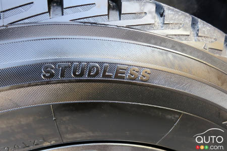 The word Studless identifies this winter tire as having a grip without studs, but similar to a studded tire.